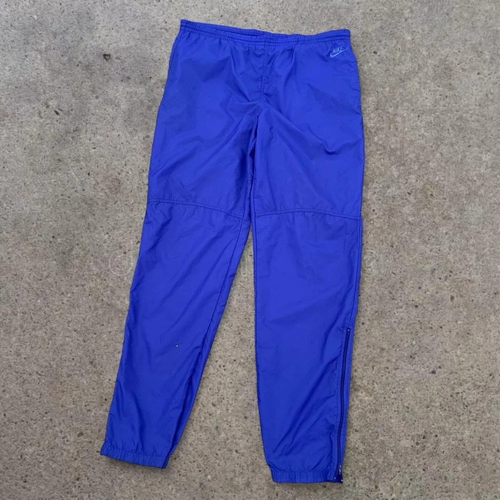 Vintage Y2K Era Nike Medium Royal Blue Nylon Windbreaker Track Pants 2007 Mens